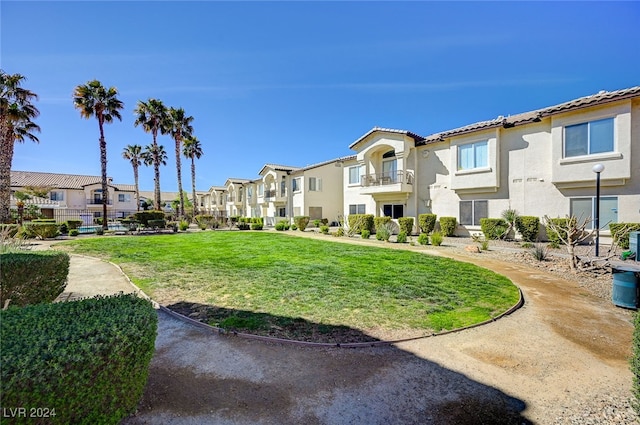 view of home's community with a lawn