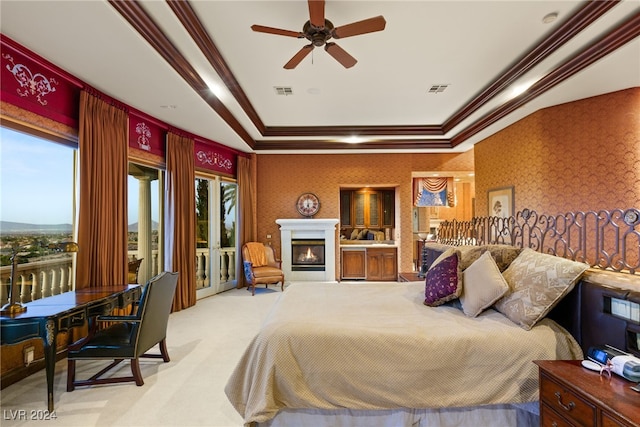 bedroom featuring wallpapered walls, ornamental molding, and access to exterior