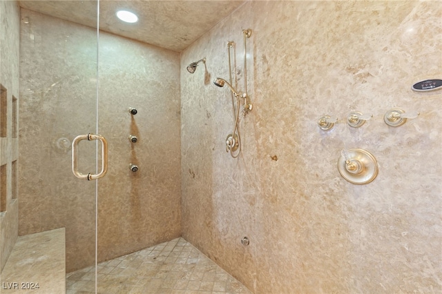 bathroom with tiled shower