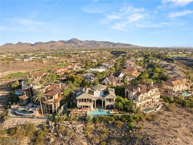 birds eye view of property with a mountain view