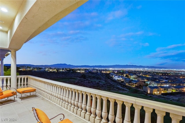 balcony at dusk with a mountain view