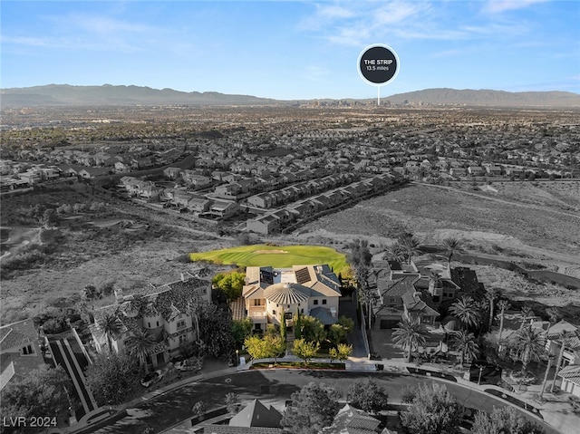 birds eye view of property featuring a mountain view