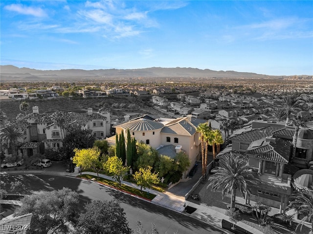 birds eye view of property with a mountain view