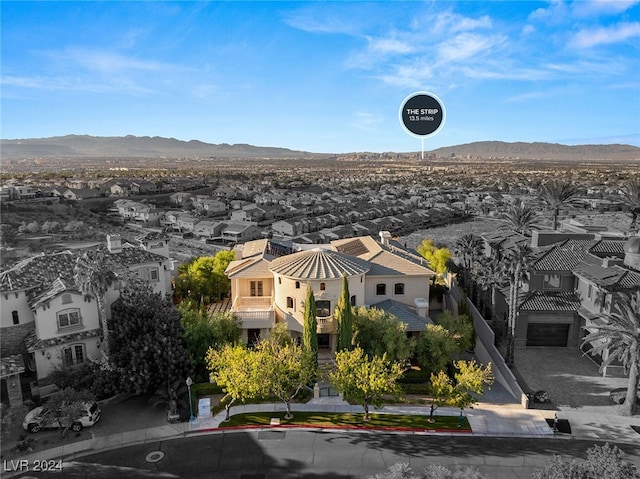 birds eye view of property featuring a mountain view