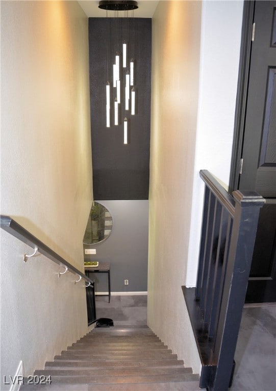 staircase featuring wood-type flooring