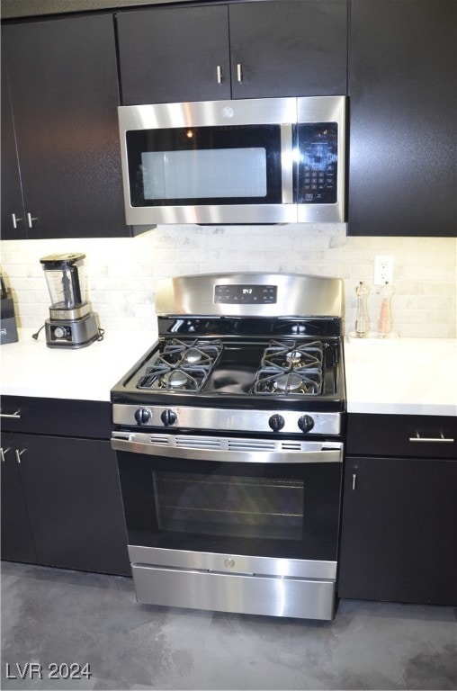 kitchen with appliances with stainless steel finishes and decorative backsplash