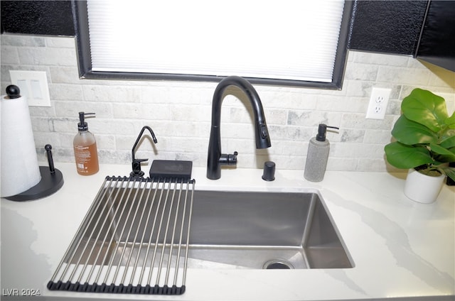 details with sink and tasteful backsplash