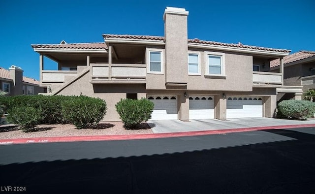 view of front of property with a garage