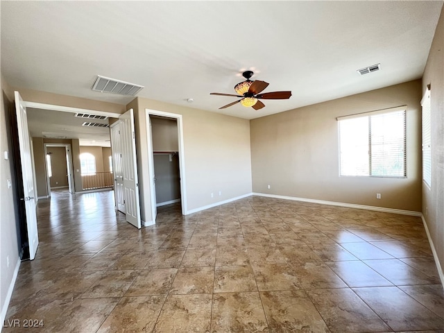 spare room with ceiling fan