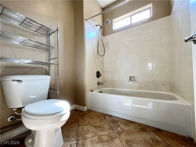 bathroom featuring shower / bath combination and toilet