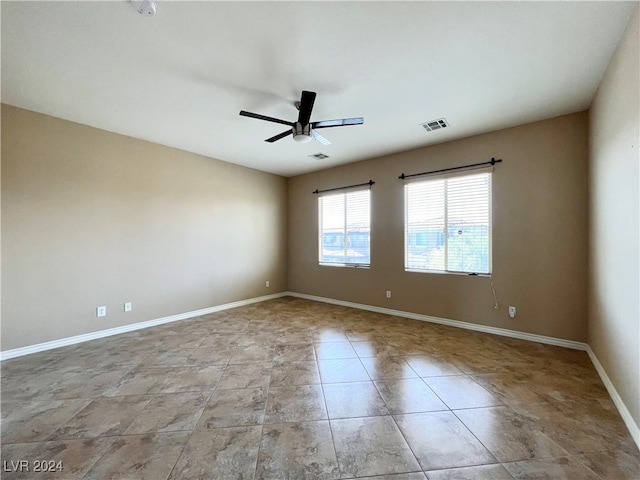 spare room featuring ceiling fan