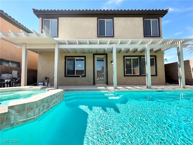 back of house featuring a pergola