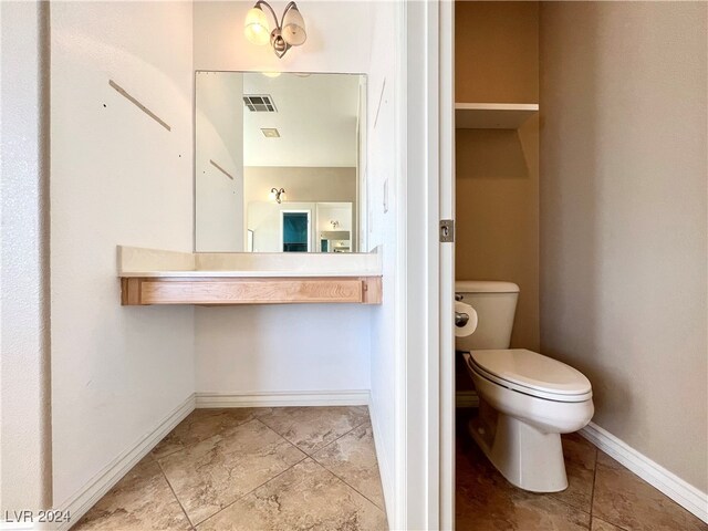 bathroom featuring toilet