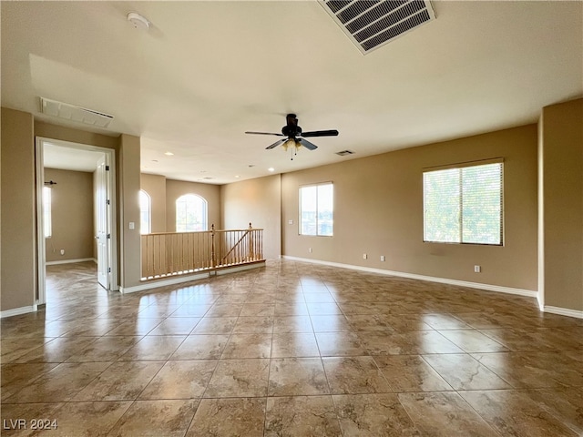 spare room with ceiling fan