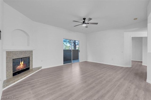 unfurnished living room featuring light hardwood / wood-style floors and ceiling fan