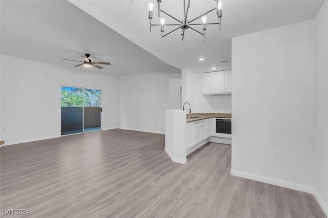 unfurnished living room with ceiling fan with notable chandelier, light hardwood / wood-style floors, and sink