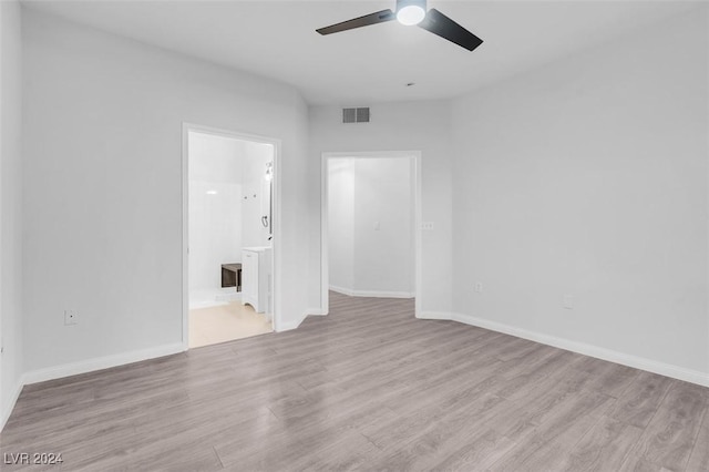 empty room with light wood-type flooring and ceiling fan