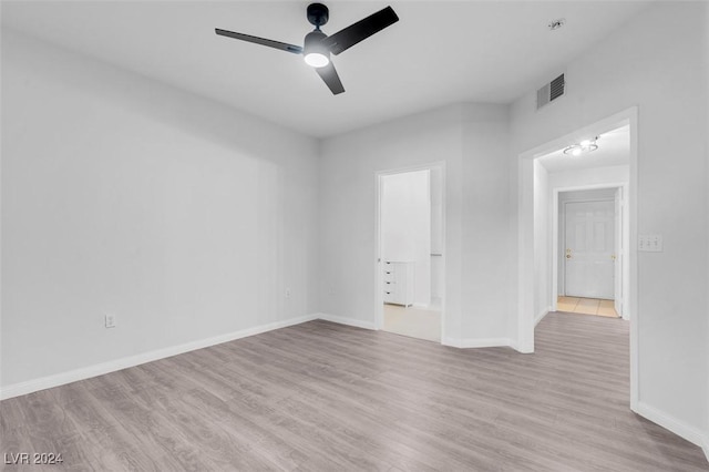 spare room featuring ceiling fan and light hardwood / wood-style flooring