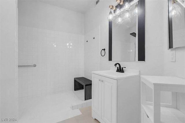 bathroom with vanity, tile patterned floors, and walk in shower