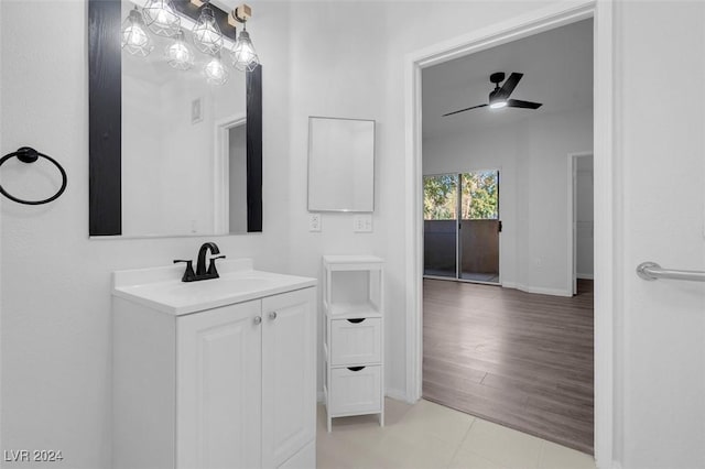 bathroom featuring tile patterned floors, ceiling fan, and vanity