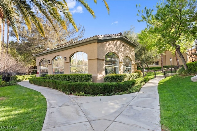 view of property exterior with a yard