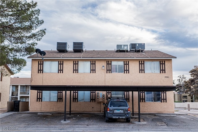 exterior space featuring a carport and central AC unit