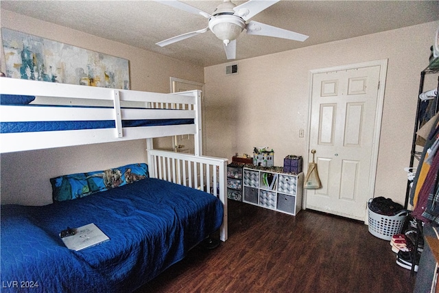 bedroom featuring dark hardwood / wood-style floors and ceiling fan