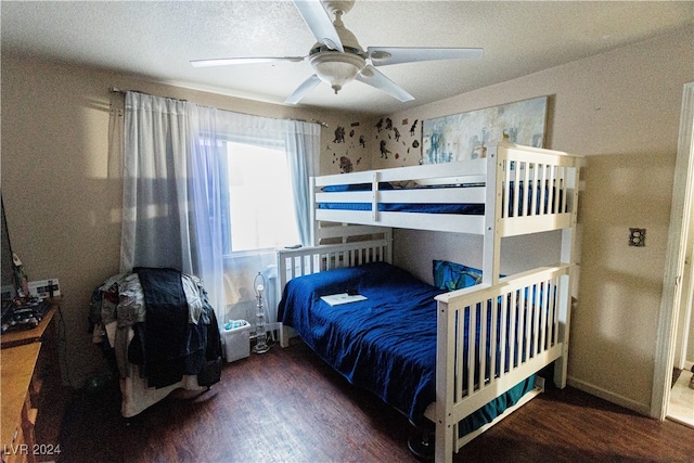 bedroom with ceiling fan and dark hardwood / wood-style flooring