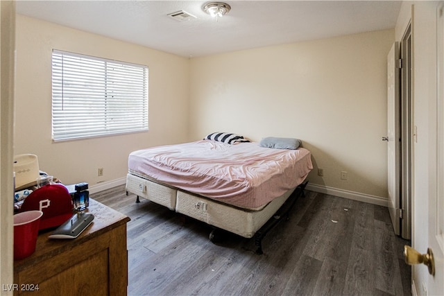 bedroom featuring dark hardwood / wood-style floors