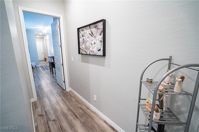 corridor featuring hardwood / wood-style flooring