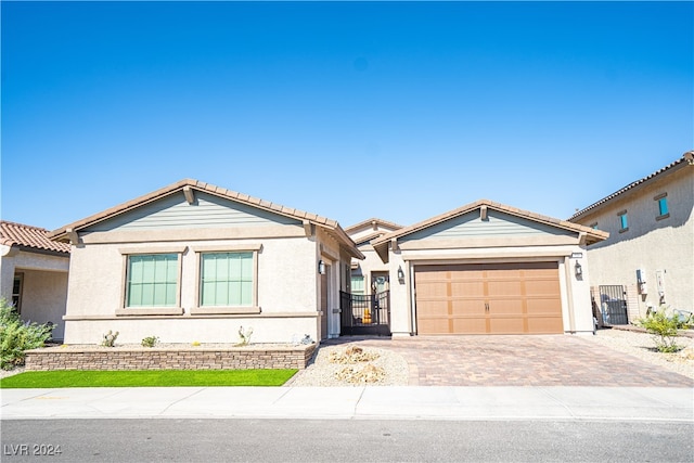 ranch-style home with a garage