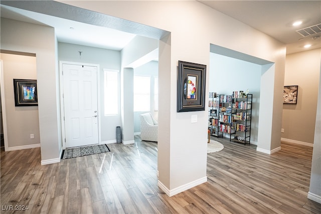 entryway with hardwood / wood-style floors