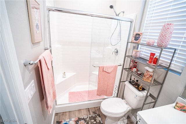 bathroom with toilet, walk in shower, wood-type flooring, and vanity