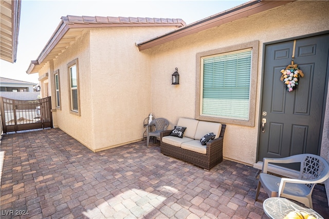 property entrance featuring a patio