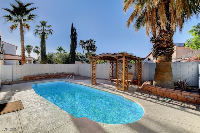 view of swimming pool featuring a patio and a pergola