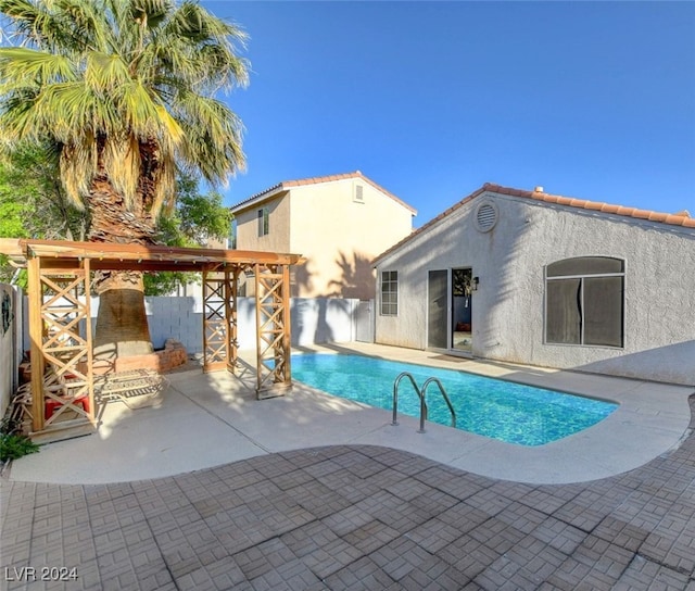 view of swimming pool featuring a patio