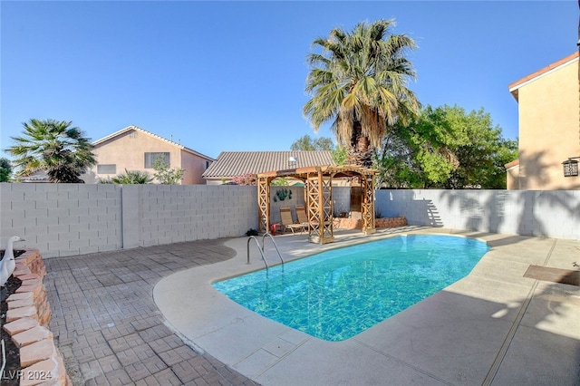 view of swimming pool featuring a pergola and a patio area