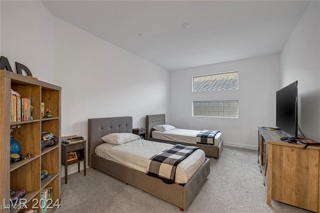 bedroom featuring light carpet