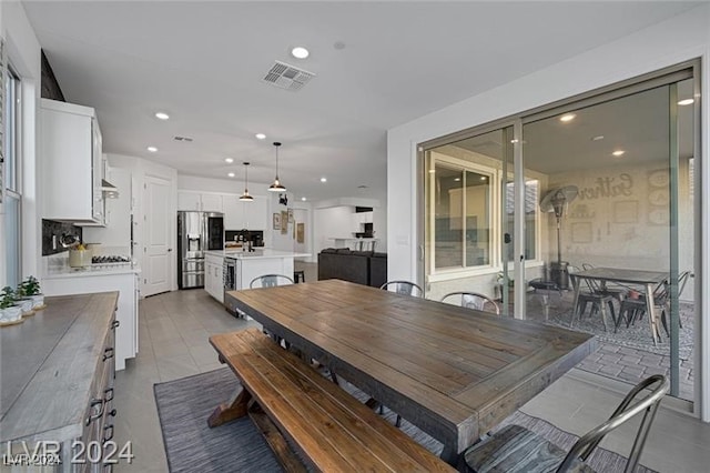 dining space with light tile patterned floors