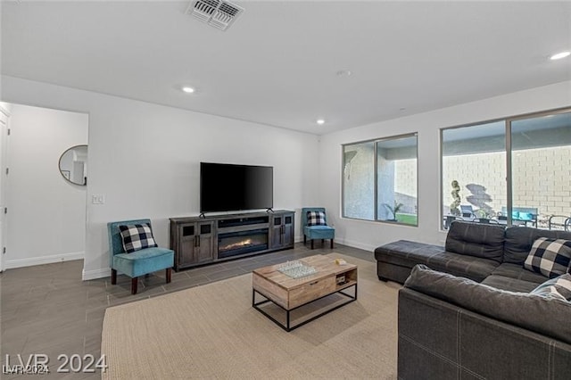 living room featuring a fireplace