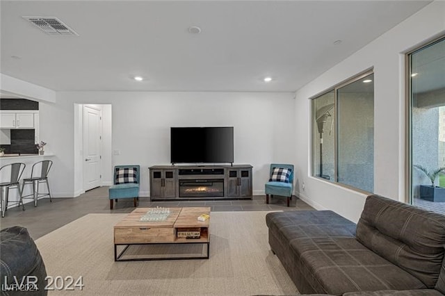 living room with concrete flooring