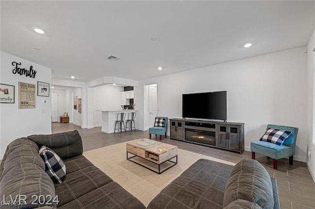 living room featuring a fireplace