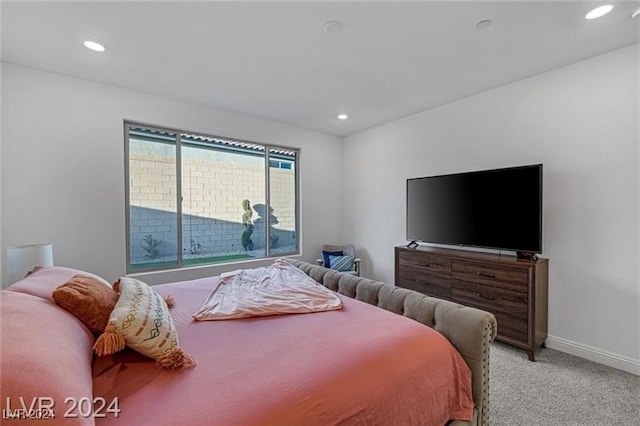 bedroom with light colored carpet