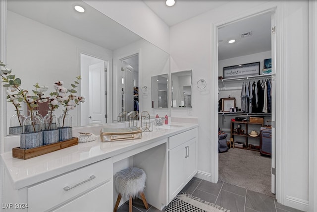 bathroom with vanity and tile patterned flooring