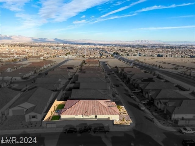 drone / aerial view featuring a mountain view