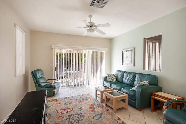 tiled living room featuring ceiling fan