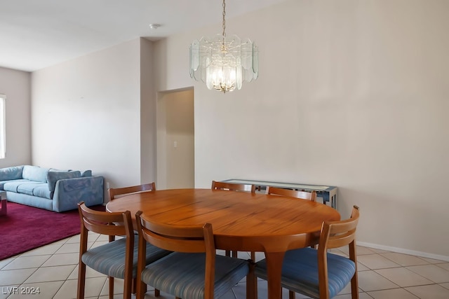 tiled dining area with a notable chandelier