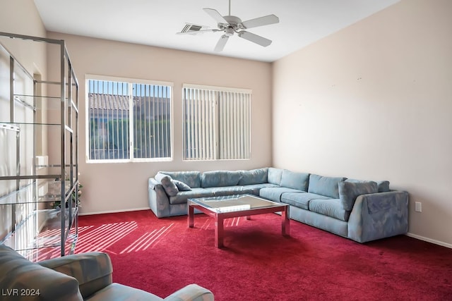 carpeted living room with ceiling fan