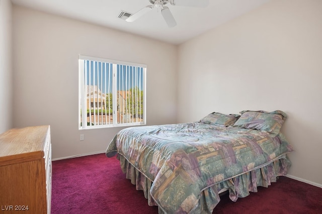 bedroom featuring dark carpet and ceiling fan