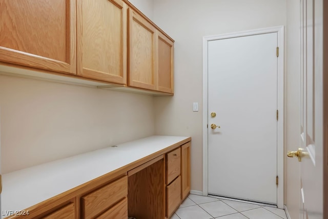 doorway to outside featuring light tile patterned floors